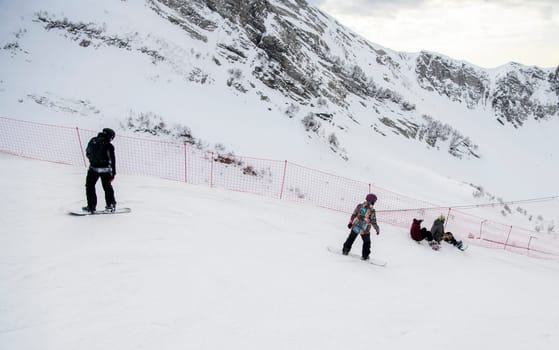 Sochi  Russia - January 02  2021: Snowboarders go downhill at the Krasnaya Polyana ski resort