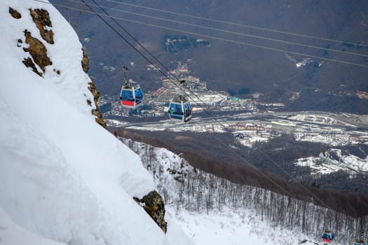 Sochi  Russia - January 02  2021: Skiers climb the cable car at the Krasnaya Polyana ski resort