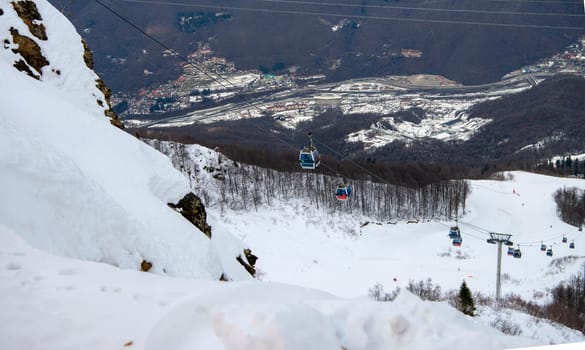 Sochi  Russia - January 02  2021: Skiers climb the cable car at the Krasnaya Polyana ski resort