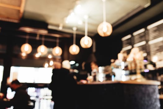 Blurred loft coffee shop with barista and customer. High quality photo