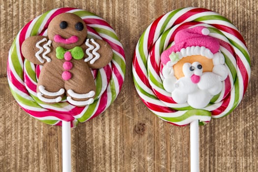 Christmas lollipops with gingerbread man and face of Santa