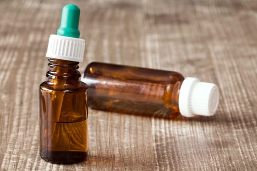 Small medical bottles filled with transparent liquid