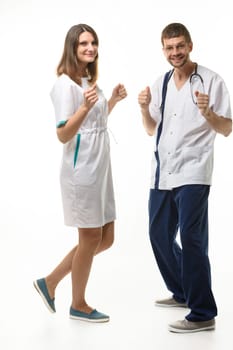 the doctor and nurse happily dance to the happy news