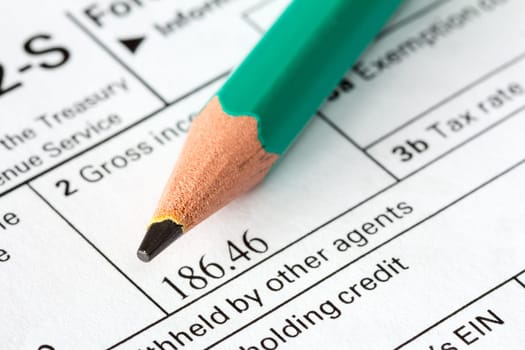 Tax form business financial concept: macro view of individual  tax form and pencil