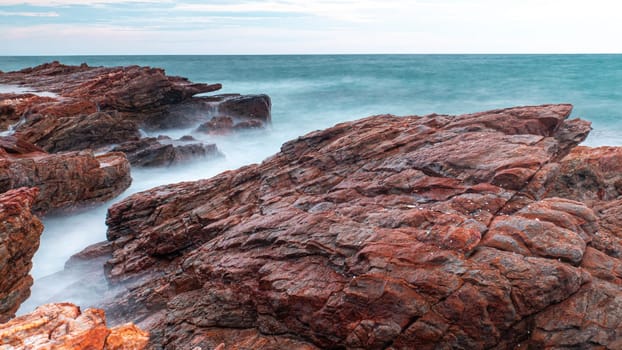 Long Exposure Of Sea With Smooth Wave And Rock. nature of Seascape