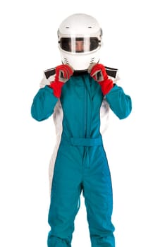 Racing driver putting on his helmet isolated in white