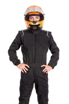 Racing driver in full gear posing isolated in a white background