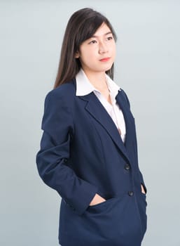 Portrait of asian businesswoman isolated on gray background