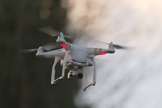 Great Malvern, United Kingdom, 27th December, 2020: Camera drone with blurred background and plenty of copy space. Sunset colors and evening light