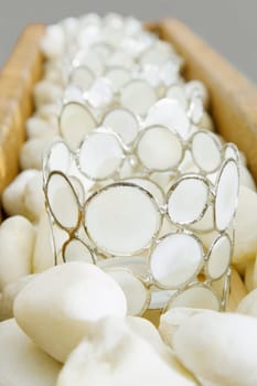 Close-up of decorative glasses on pebbles