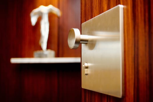 Close-up of a doorknob of a cabinet