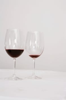 Close-up of two wine glasses on a dining table