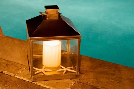 Close-up of a lantern at the poolside