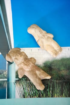 Close-up of two figurines on a magazine