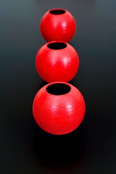 Close-up of three decorative urns in a row