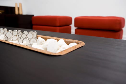 Close-up of decorative glasses on pebbles