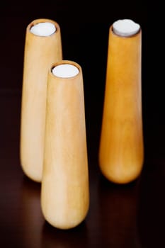 Close-up of three candlestick holders