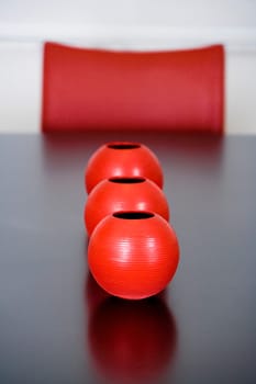 Decorative urns on a dining table in a dining room
