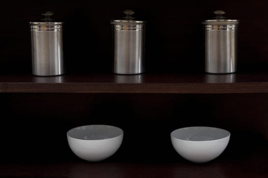Close-up of kitchen utensil in shelves