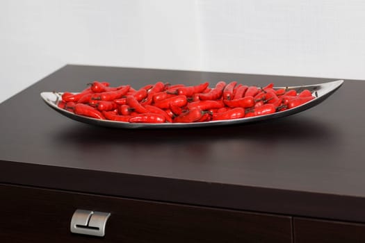 Close-up of red chili peppers in a tray