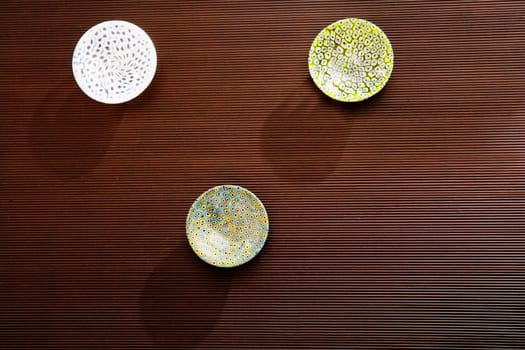 High angle view of three ceramic bowls on a table
