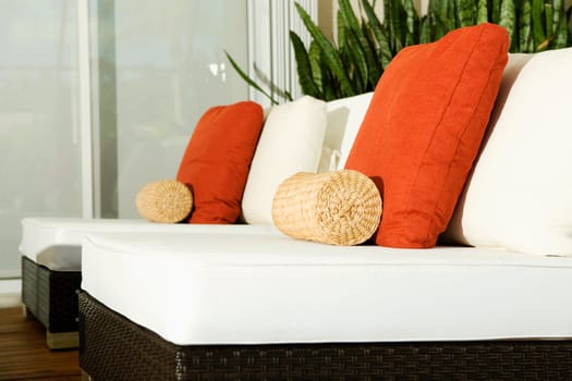 Close-up of cushions on chairs in a living room
