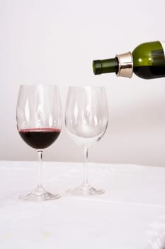 Wine being poured into wine glasses