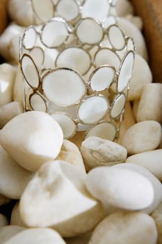 Close-up of decorative glasses on pebbles