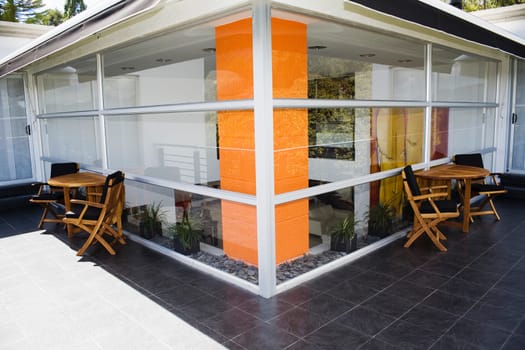 Tables and chairs outside a house