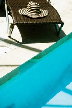 High angle view of a lounge chair at the poolside