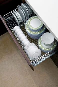 High angle view of potteries in a kitchen cabinet