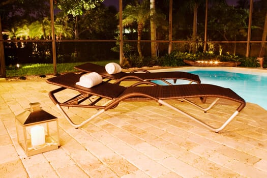 Empty lounge chairs at the poolside