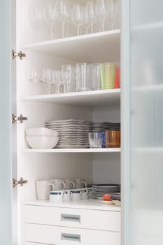 Crockery in a kitchen shelf