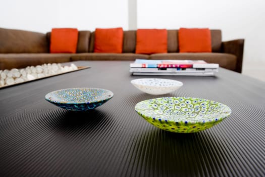 Ceramic bowls and magazines on a table