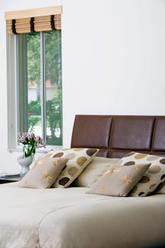 Cushions and pillows on the bed