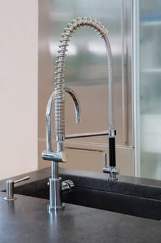 Close_up of a faucet on a kitchen counter