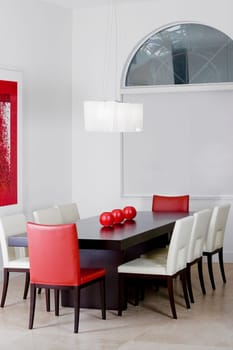 Decorative urns on a dining table in a dining room