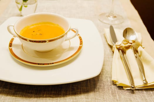 Close_up of soup in a bowl on a dining table