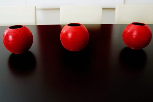 Close_up of decorative urns on a dining table in a dining room