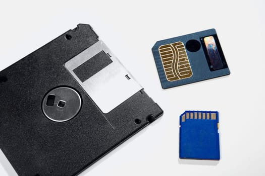 Close-up of a floppy disk and memory cards