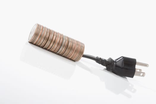 Stack of coins with a three pin plug