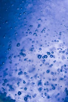 Close_up of water droplets on a blue background