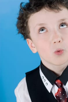 Close_up of a boy looking up