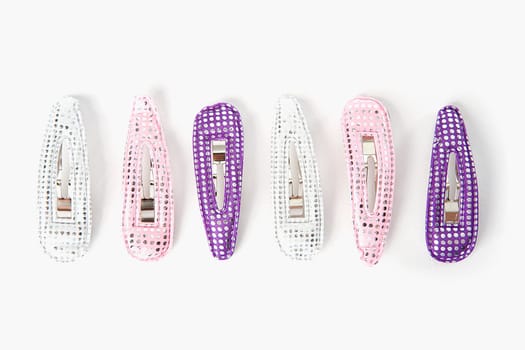 Close-up of a group of hair clips in a row