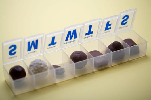 Close-up of nuts in a plastic pill box
