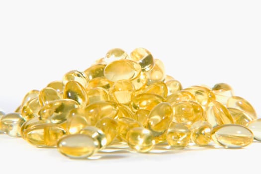 Close-up of a heap of vitamin E capsules
