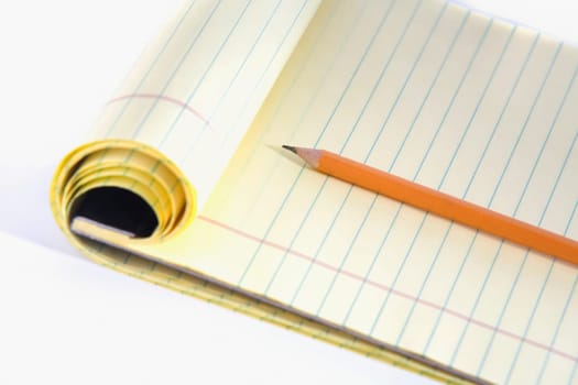 Close-up of a pencil on a notepad