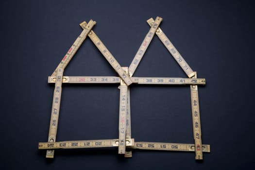 Close-up of a measuring scale in the shape of houses