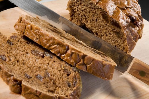 Close-up of a knife with the slices of cake