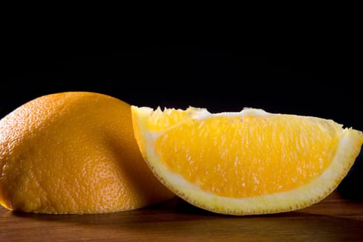 Close-up of two slices of tangerine on a table